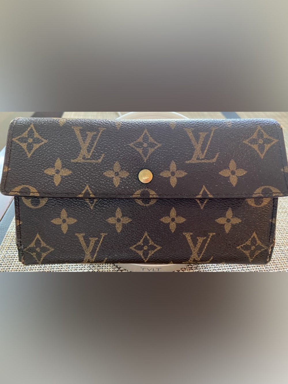 Louis Vuitton Monogram Canvas Wallet. Front snap closure with coin pouch